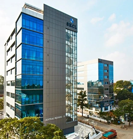 A modern office building complex in India with reflective glass facades.